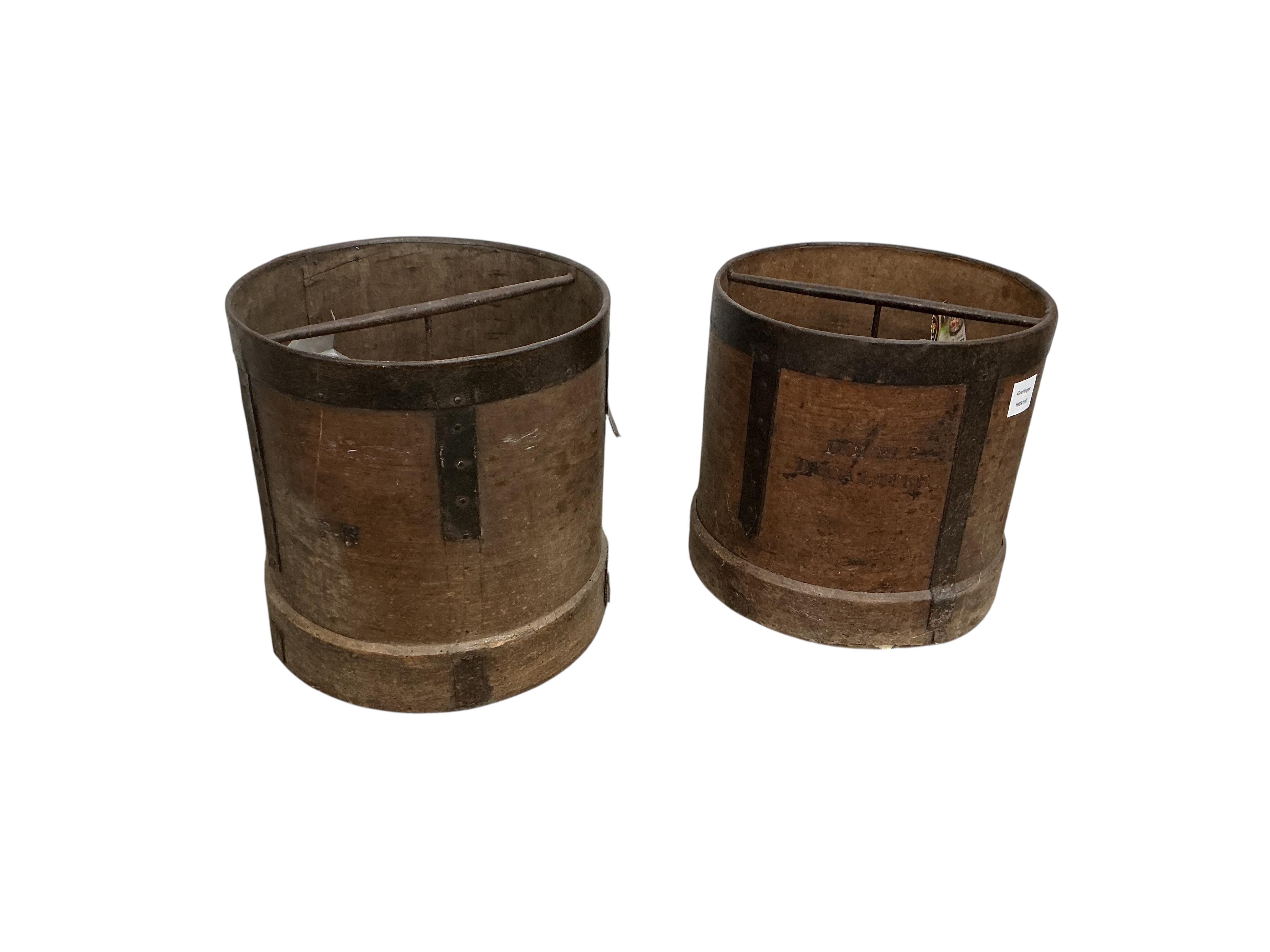 Two 19th century French iron mounted measures, diameter 30cm, height 33cm together with two Victorian brass fenders and two brass fire implements